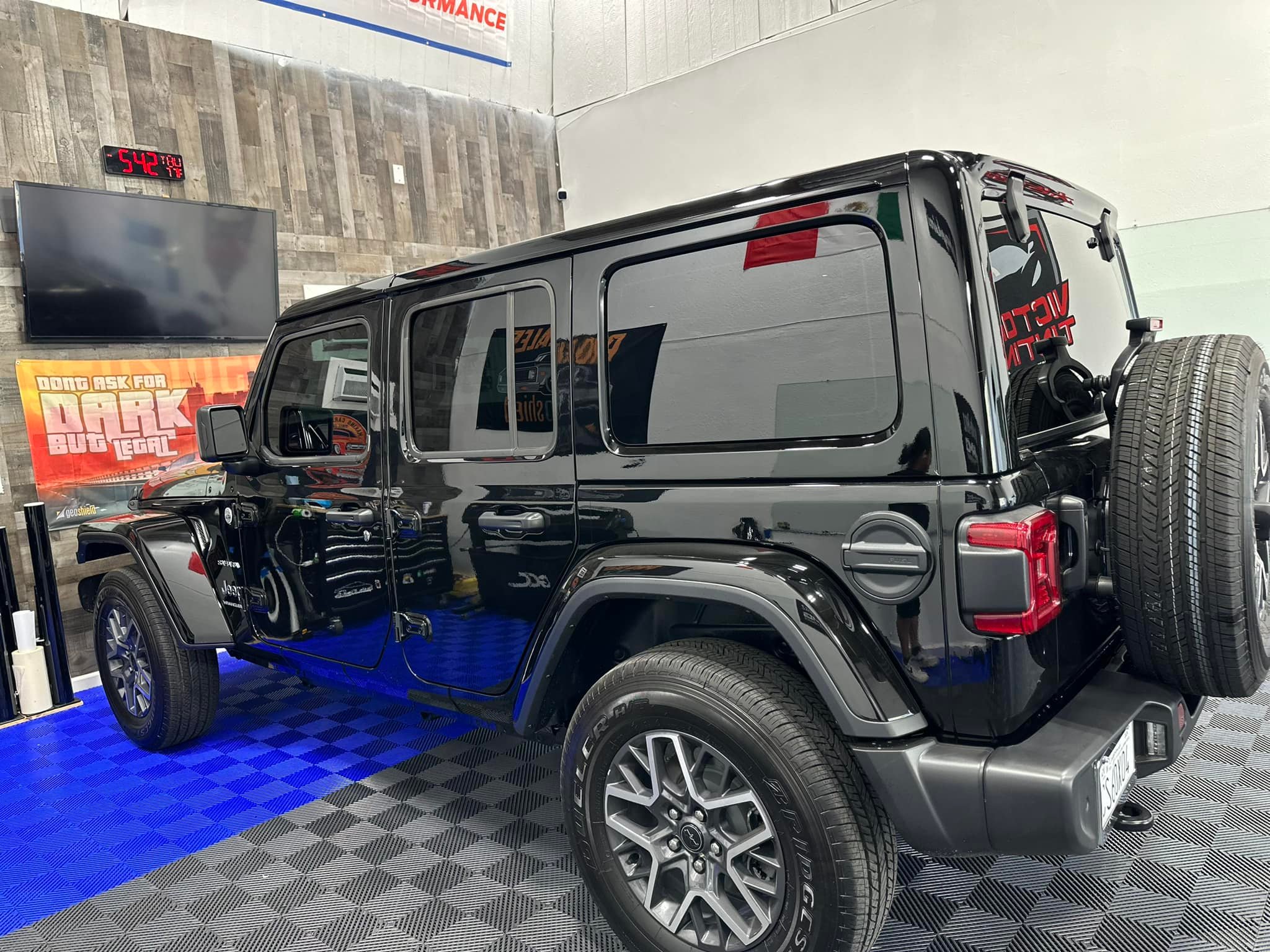Professional ceramic window tinting installation - Jeep Wrangler in shop, Fresno CA - Victory Window Tinting