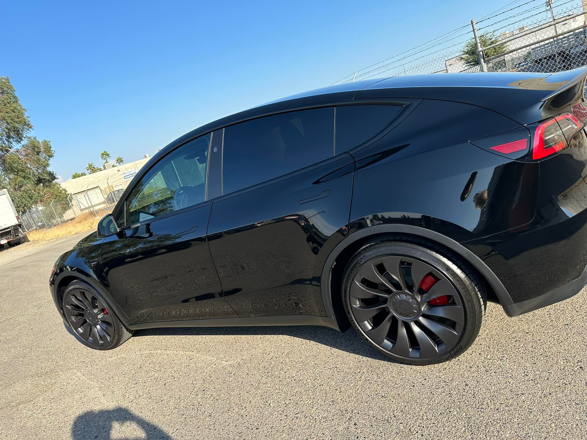 Mobile window tinting service in progress - Tesla being tinted on-site in Fresno by Victory Window Tinting